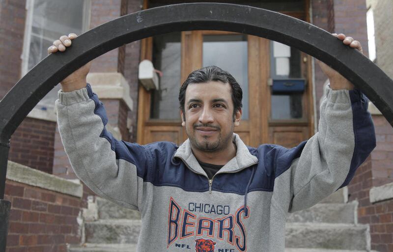 This photo taken, Monday, March 12, 2012, in Chicago shows Miguel Rojano outside his home. While the U.S. government is offering to shelve some deportation cases under a new initiative to focus resources on ridding the country of hardened criminals, some