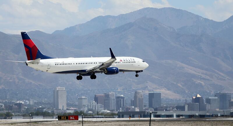 A Delta plane lands at the Salt Lake City International Airport on Tuesday, Sept. 13, 2016.