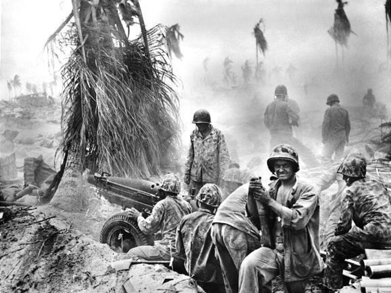 U.S. Marines man an artillery position during the amphibious landing at Tarawa in November 1943. About 1,000 Americans died in three days.