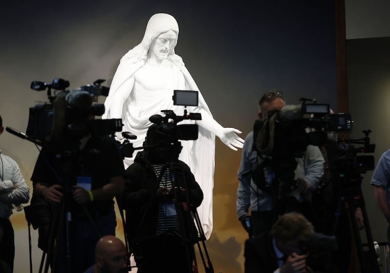 News cameras capture video in front of the Christus statue at a press conference in the Washington D.C. Temple Visitors’ Center.