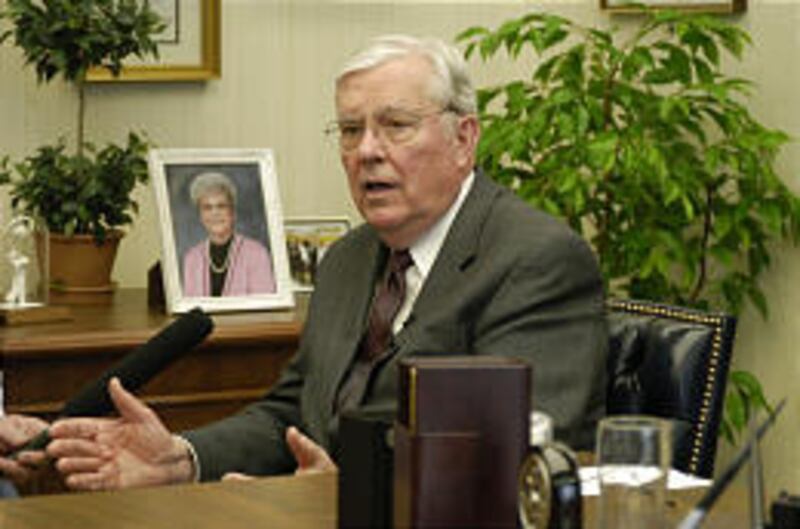Elder M. Russell Ballard speaks Friday following the slaying of one missionary and the deaths of two others.