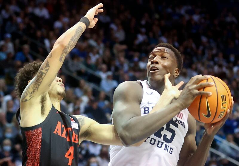 BYU forward Fousseyni Traore pulls the ball away from SDSU’s Trey Pulliam during game at the Marriott Center in Provo.
