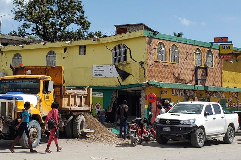 The K-oriol mini mart building is damaged after an earthquake in Les Cayes, Haiti, Saturday, Aug. 14, 2021.