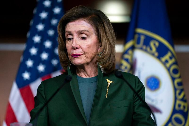 Speaker of the House Nancy Pelosi pauses as she speaks during a news conference.