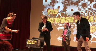 2017 Newbery Award winning author Kelly Barnhill, left, James Kennedy, a young participant and author Keir Graff onstage at a 90-Second Newbery Film Festival.