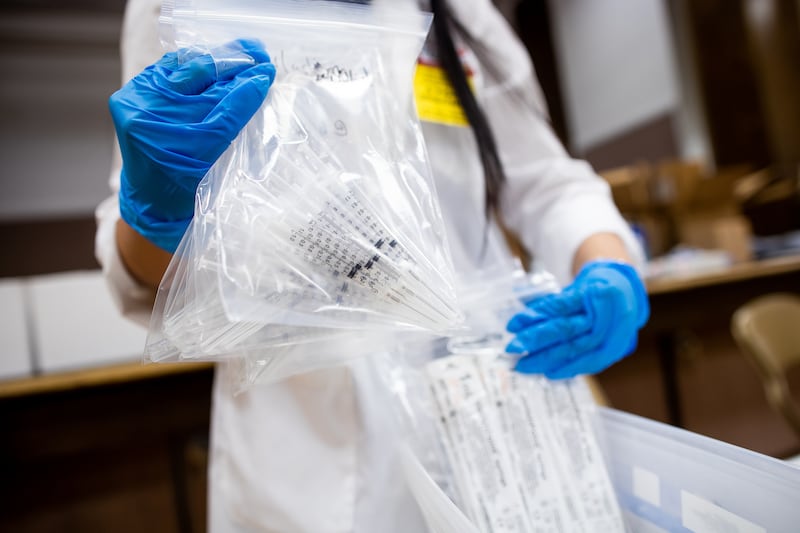 Smith’s pharmacist Thuy Holley sorts through packets of syringes for administering the Pfizer-BioNTech COVID-19 vaccine during a vaccination event at a church in Salt Lake City on Saturday, March 20, 2021. The Utah Pacific Islander Health Coalition, Smith’s Pharmacy and Salt Lake County teamed up to host the event, with the plan of administering up to 1,170 doses of the Pfizer-BioNTech COVID-19 vaccine to people of Pacific Islander descent.