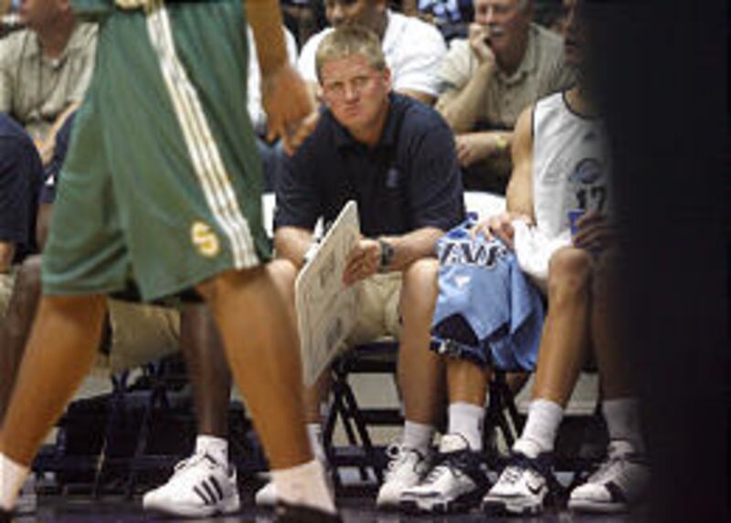 Utah Flash coach Brad Jones watches the action as the Utah Jazz face the Seattle Sonics in the Rocky Mountain Revue at Salt Lake Community College in Taylorsville Tuesday. Jones is no stranger to Jazz coach Jerry Sloan and his system.