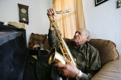 Saxophone player Joe McQueen, still going strong as he nears his 99th birthday, Joe assembles his horn at his Ogden home on Saturday, May 26, 2018.