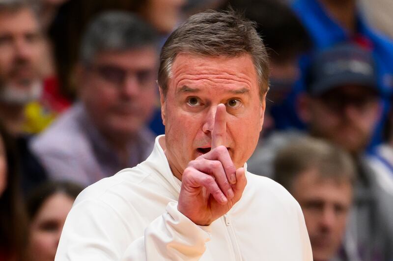 Kansas head coach Bill Self signals to his team during the second half of an NCAA college basketball game against Baylor in Lawrence, Kan., Saturday, Feb. 10, 2024. (AP Photo/Reed Hoffmann)