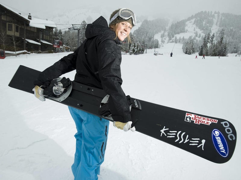 ** CORRECTS CITY TO TETON VILLAGE, WYO. ** Alpine snowboarder Lindsay Lloyd walks around Jackson Hole Mountain Resort in Teton Village, Wyo., on Dec. 3, 2010. When she's not training, World Cup alpine snowboarder Lloyd teaches at Jackson Hole Mountain Sp