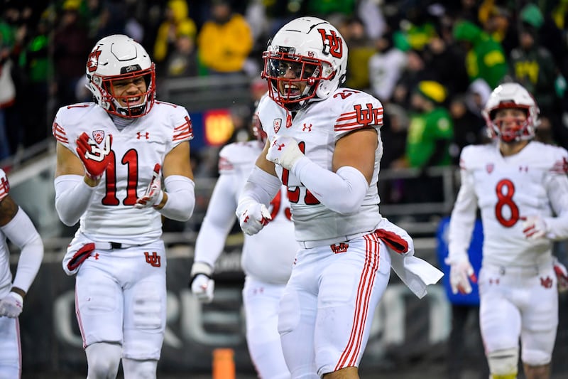 Utah linebacker Karene Reid (21) celebrates his fumble return touchdown against Oregon Nov. 19, 2022, in Eugene, Ore.