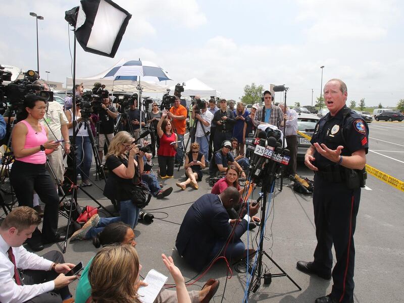 Waco Police Sgt. Patrick Swanton addresses the media as law enforcement continues to investigate the motorcycle gang related shooting at the Twin Peaks restaurant, Monday, May 18, 2015, in Waco, Texas, where nine were killed Sunday and over a dozen injure