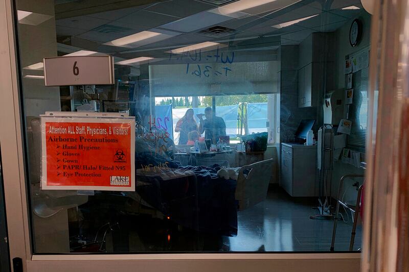 Family members gather outside at a hospital in Missouri.