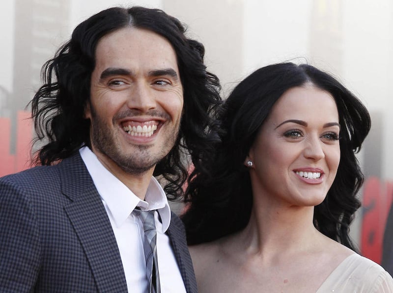FILE- In this Tuesday, April 19, 2011 file photo, British actor Russell Brand and his wife Katy Perry arrive for the European premiere of Arthur, in London.