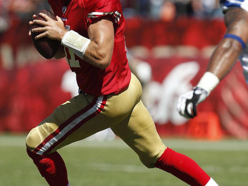 FILE - In this Sept. 18, 2011 file photo, San Francisco 49ers' quarterback Alex Smith (11) looks to pass gainst the Dallas Cowboys in an NFL football game in San Francisco.
