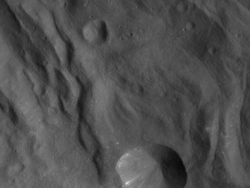This image released Monday, Dec. 5, 2011, by the Dawn spacecraft shows the surface of the massive asteroid Vesta. Since entering orbit around Vesta in July, Dawn has been beaming back images of the asteroid surface.
