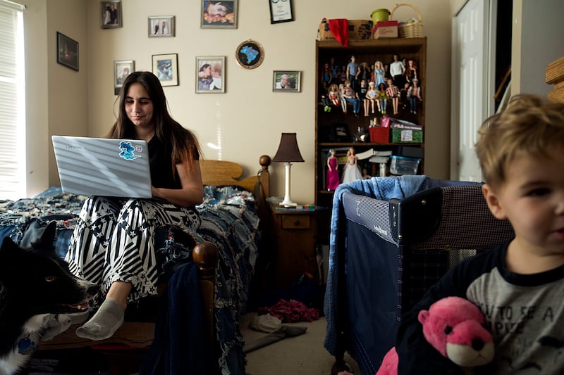 Janci Patterson, a stay-at-home writer, works on her adult romance series called "The Extra" while her son, Kenton, plays at their home in Orem on Friday, Dec. 14, 2018.