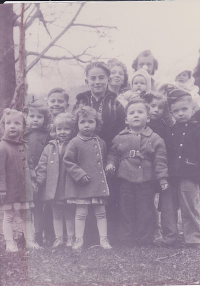 A picture of Sherry Young's husband, LeGrande "Grit" Young, who is standing prominently in the center in his plaid jacket, with his Leonard cousins. The picture of their impish looking father/grandfather and great-grandfather is a family treasure.