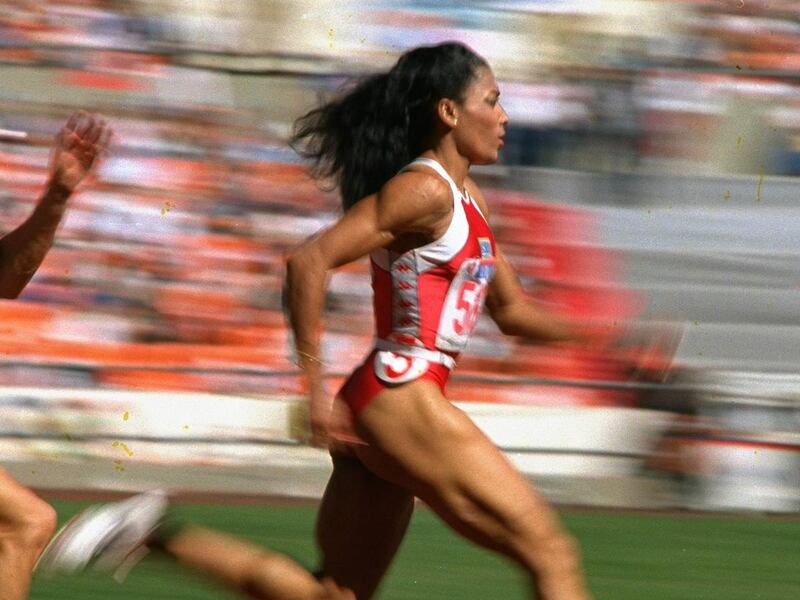 U.S. sprinter Florence Griffith Joyner strides to a world record in a semifinal heat of the Olympic women's 200-meter dash in Seoul on Thursday, Sept. 29, 1988. If a proposal being considered by the IAAF passes, her records in the 100- and 200-meter dashe