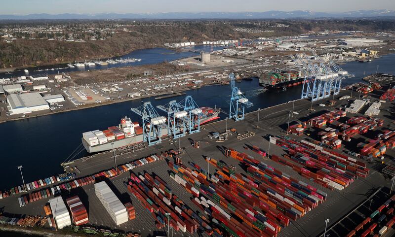 FILE - In this March 5, 2019, file photo, cargo containers are staged near cranes at the Port of Tacoma, in Tacoma, Wash. China has announced tariff hikes on $60 billion of U.S. goods in retaliation for President Donald Trump's escalation of a fight over