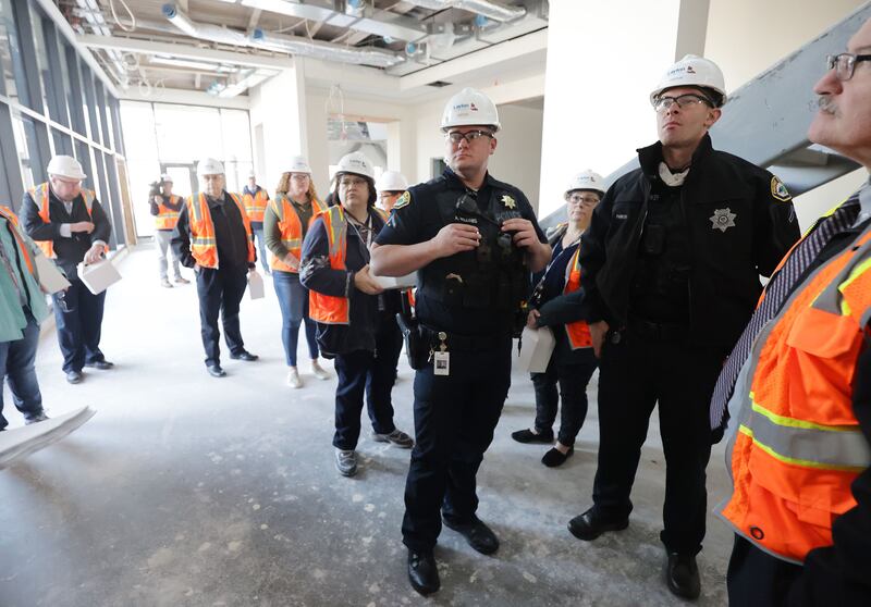 People tour the public safety building now under construction in Provo on Tuesday, Nov. 30, 2021.
