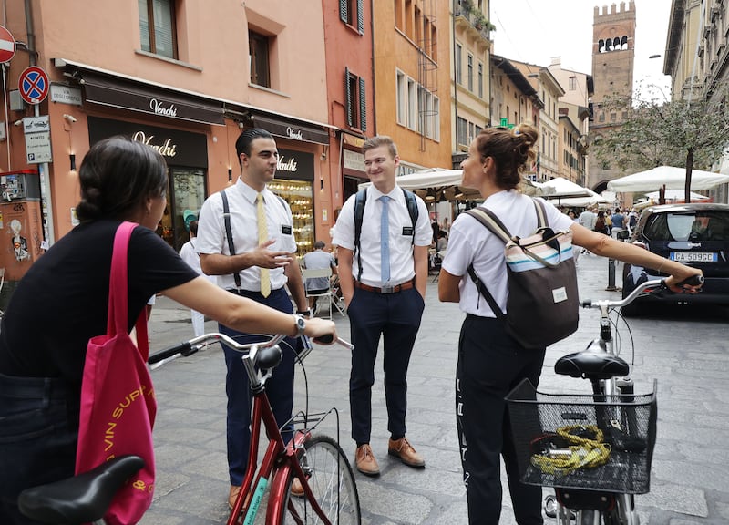 Latter-day Saint missionaries are shown on the street in Bologna, Italy, in 2021. The church has updated its missionary standards.