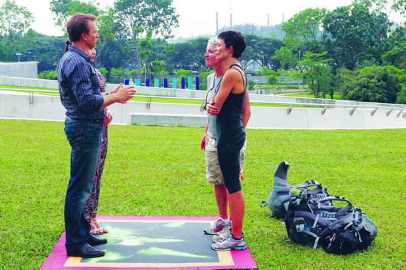 Phil Keoghan tells Brandy Snow, far right, and Carol Rosenfeld they've been eliminated.