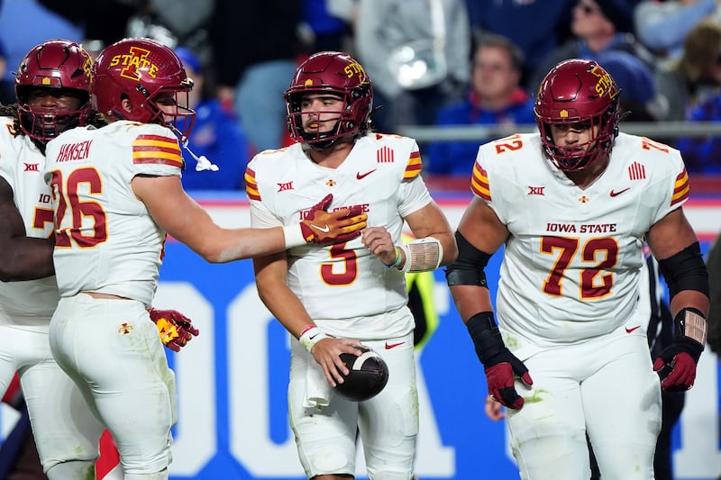 Iowa State quarterback Rocco Becht (3) celebrates with teammates after running for a two-point conversion during game against Kansas Saturday, Nov. 9, 2024, in Kansas City, Mo. Kansas won 45-36.