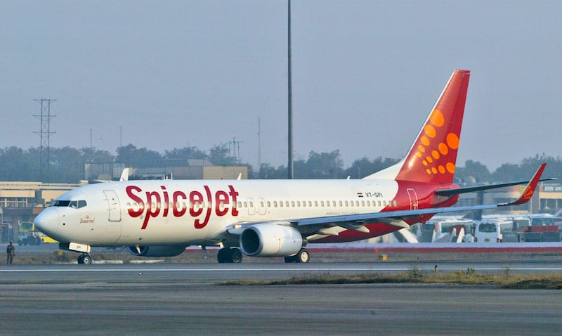 A SpiceJet aircraft taxies on the runway at the airport in New Delhi, India.