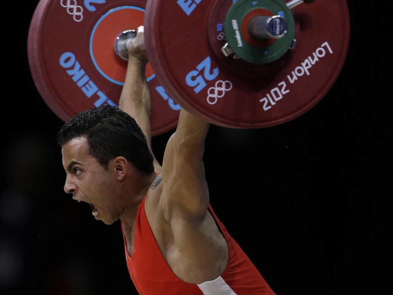 Khalil El Maoui of Tunisia competes during the mens 56-kg, group A, weightlifting competition at the 2012 Summer Olympics, Sunday, July 29, 2012, in London.