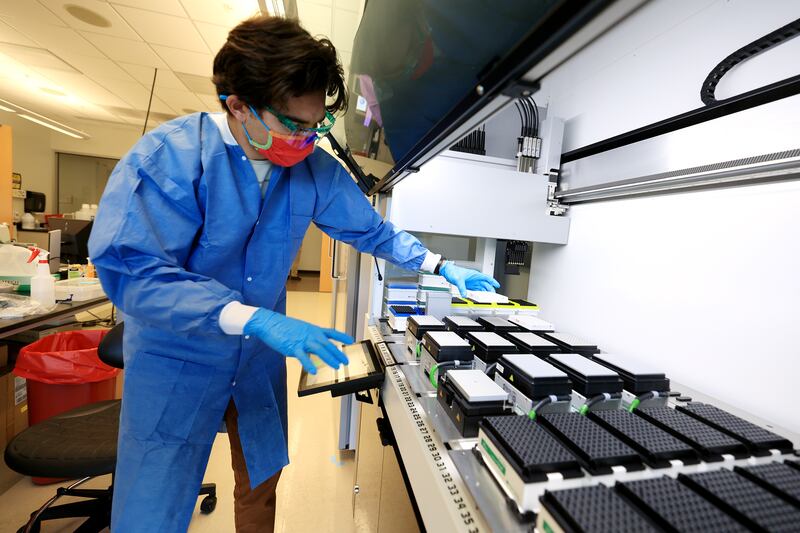 Microbiologist Samuel Philips sequences COVID-19 samples for variants at the Utah Public Health Laboratory in Taylorsville on Monday, Nov. 29, 2021.