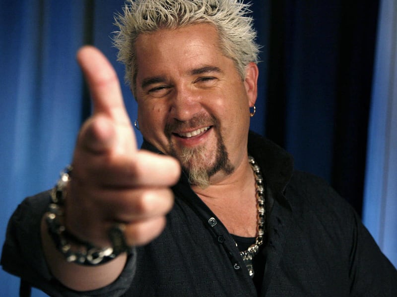 FILE - In this May 4, 2011 file photo, TV personality Guy Fieri poses for a portrait Wednesday, May 4, 2011 in New York. Fieri, who hosts the NBC game show “Minute To Win It,” talks about how he transformed the fixer upper into a sprawling ranch-style hom