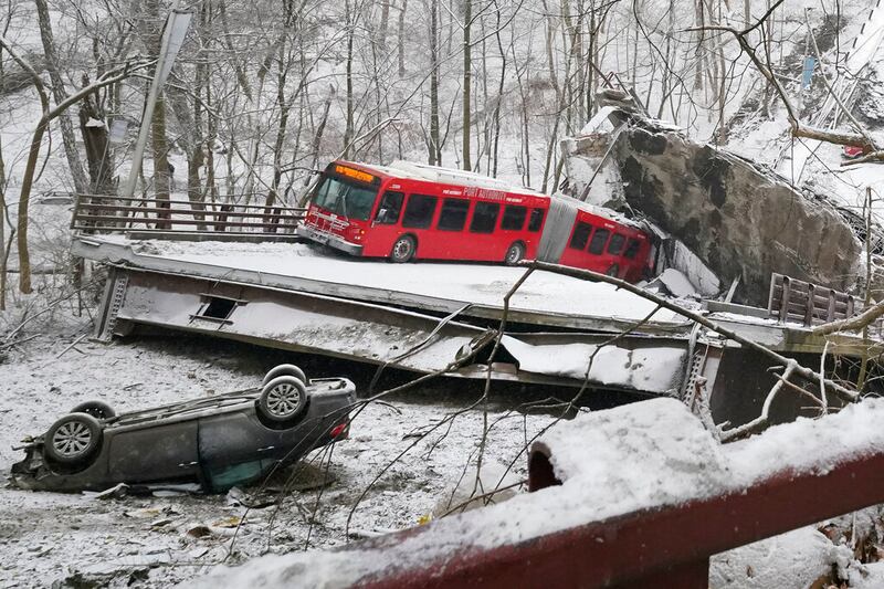 A Port Authority bus and a car in Pittsburgh’s East End.