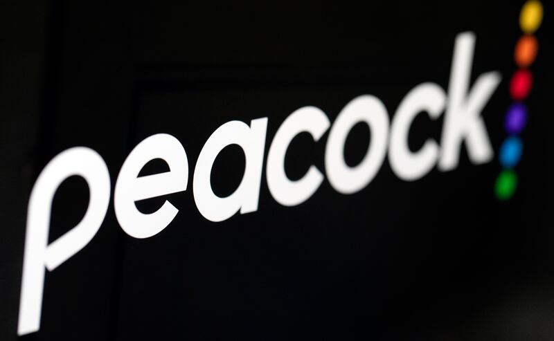 In this Jan. 16, 2020 file photo, the logo for NBCUniversal’s upcoming streaming service, Peacock, is displayed on a computer screen in New York. Peacock, one of the last big new streaming services to launch in the U.S., was supposed to get a big marketing and content boost from the Olympics.Tahe coronavirus pandemic delayed the Games to 2021, so that didn’t work out for Peacock’s owner, Comcast’s NBCUniversal.