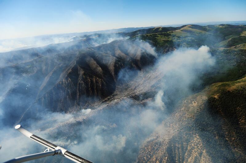 The Dollar Ridge Fire east of Strawberry Reservoir burns on Tuesday, July 3, 2018. The fire has claimed several structures.
