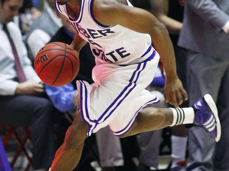 Weber's Jordan Richardson pushes the ball up court as Weber State and Eastern Washington play Saturday, March 9, 2013. Weber won 65-57.