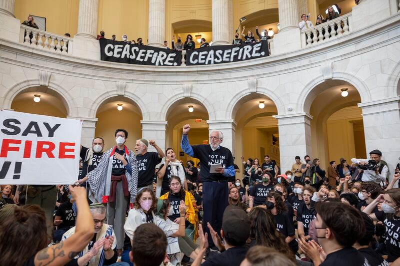 Demonstrators, calling for a cease-fire in the ongoing war between Israel and Hamas, protest inside the Cannon House Office Building in Washington on Oct. 18, 2023.