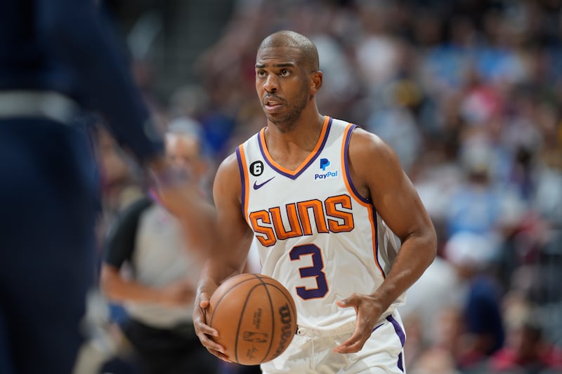 Phoenix Suns guard Chris Paul looks to pass in Game 2 of an NBA second-round playoff series against the Denver Nuggets.