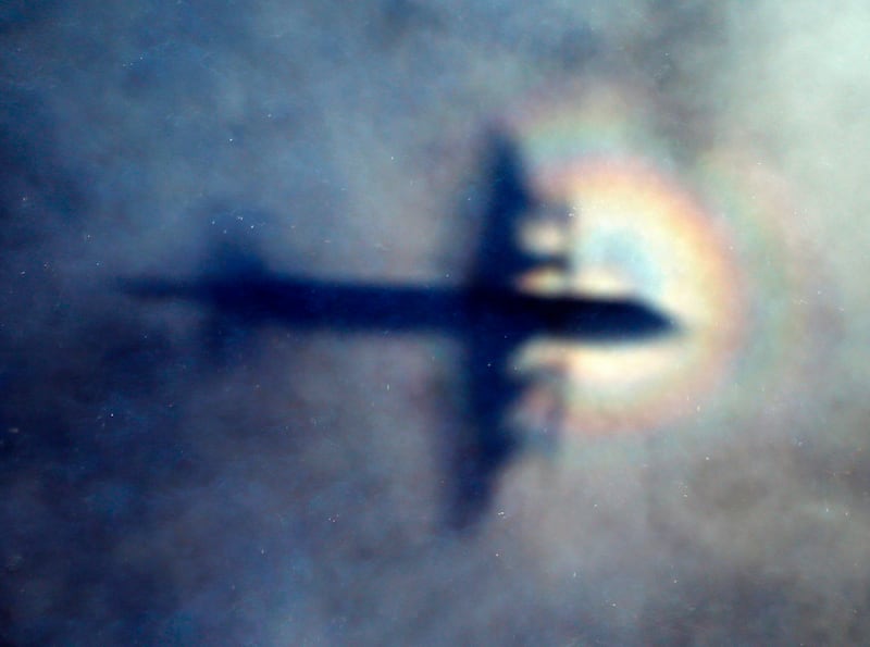 The shadow of a Royal New Zealand Air Force P3 Orion is seen on low level cloud.