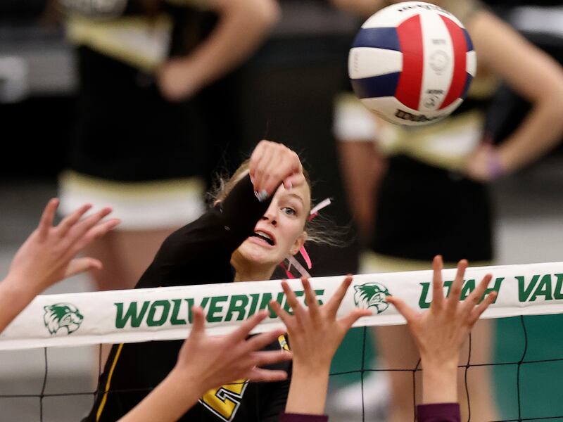 Abby Morris spikes the ball