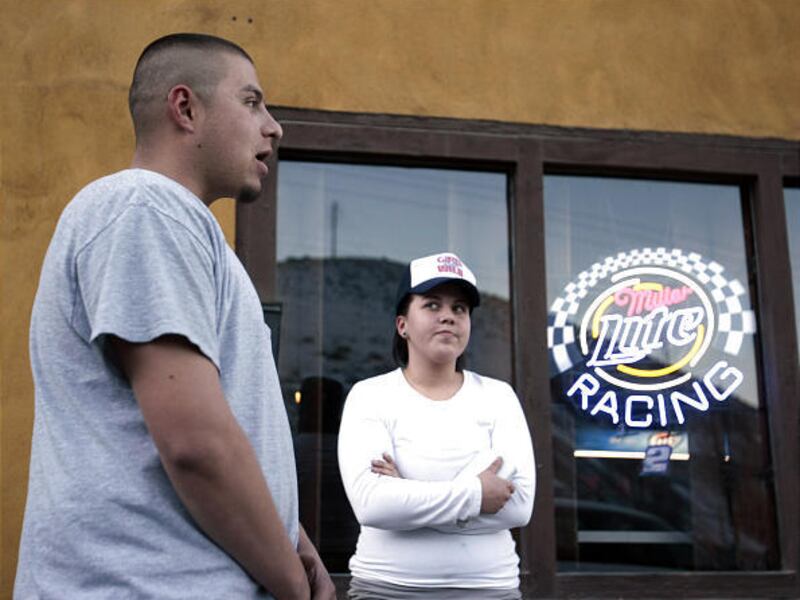 Fausto Valdez, left, and Nicolette Jorgensen talk outside the Ore House Saloon in Copperton.