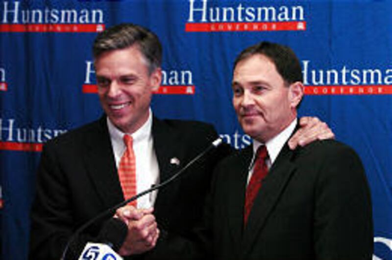 Jon Huntsman Jr., left, announces Gary Herbert as his running mate at a Tuesday press conference at Huntsman's West Valley headquarters.