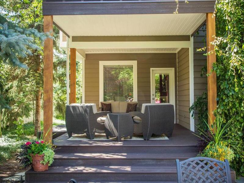 This wooden deck below the balcony adds charm and a beautiful, functional outdoor living space.
