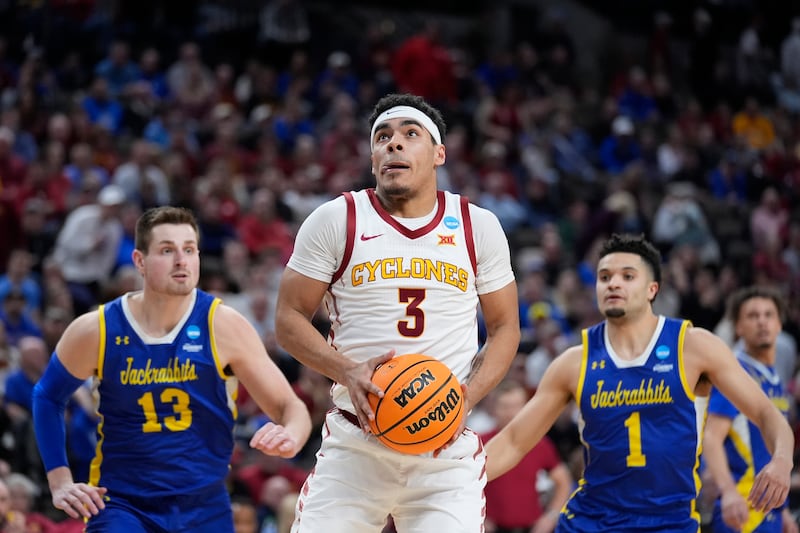 Iowa State's Tamin Lipsey heads to the basket as South Dakota State's Luke Appel (13) and Matt Mims (1) defend during NCAA Tournament game Thursday, March 21, 2024, in Omaha, Neb.