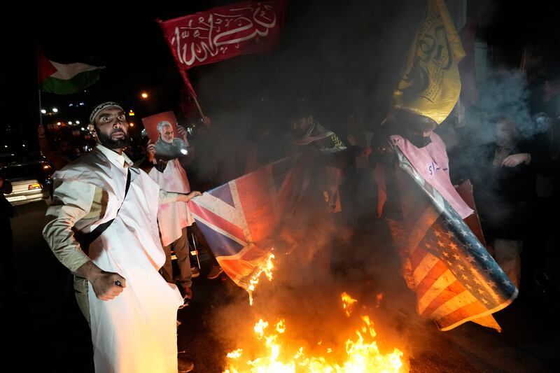 Iranian demonstrators protest against the U.S. and British military strike against Iranian-backed Houthis in Yemen, in front of the British Embassy in Tehran, Iran, on Jan. 12, 2024.