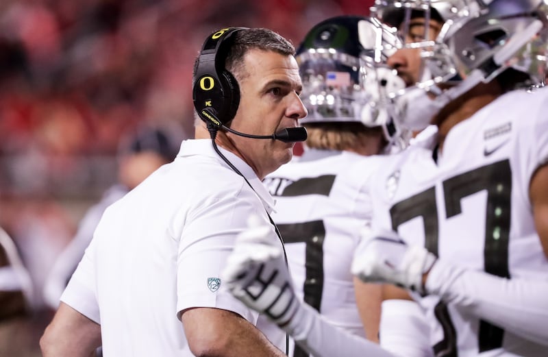 Oregon Ducks head coach Mario Cristobal huddles with players during the game against the Utah Utes at Rice-Eccles Stadium in Salt Lake City on Saturday, Nov. 10, 2018.