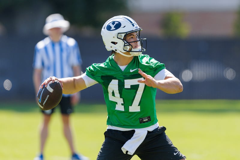 BYU quarterback Bear Bachmeier looks for a receiver Thursday afternoon during Day 2 of the Cougars' fall camp in Provo.