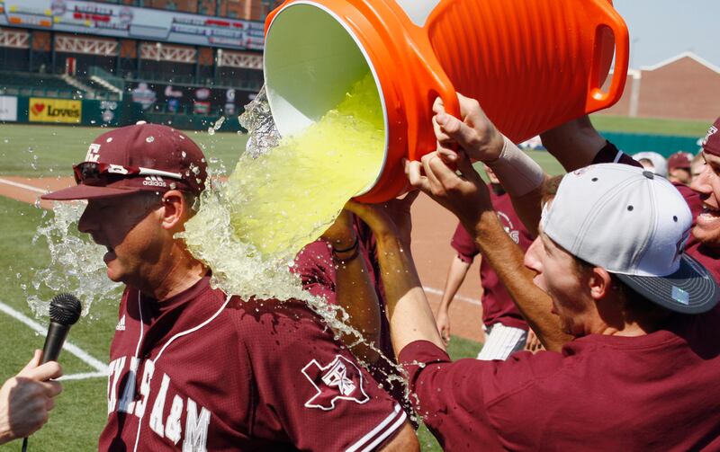 Texas A&M head coach Rob Childress gets Gatorade dumped on him by his team in 2011.