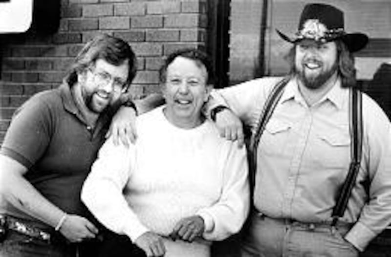KSOP founder Henry Hilton, between sons Greg and Don in 1987, aired country when "country wasn't cool."