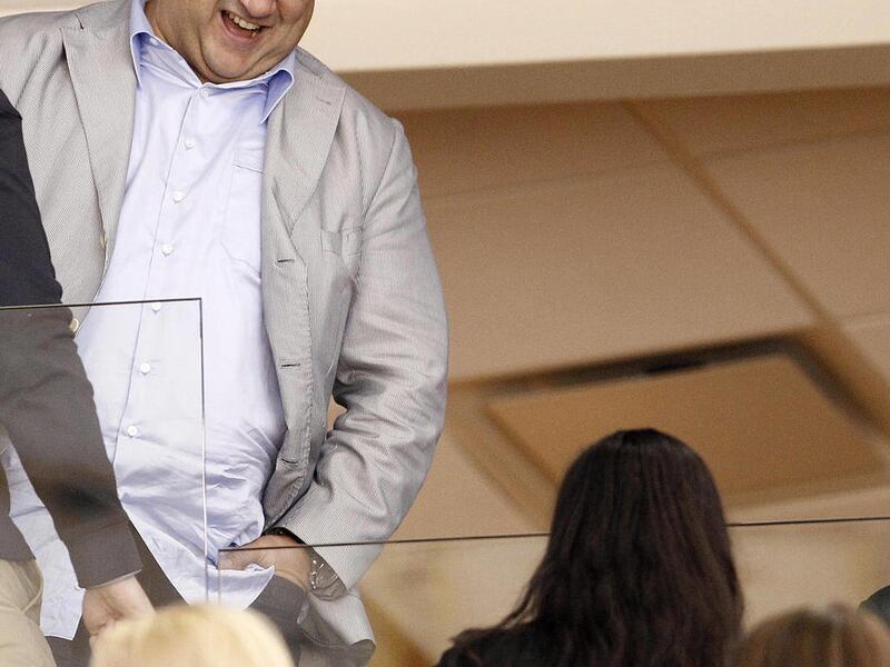 Dallas Stars owner Tom Gaglardi talks with fans during the third period of an NHL hockey game against the San Jose Sharks Saturday, Nov. 19, 2011, in Dallas. San Jose won 4-1.